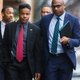 University of Virginia student Martese Johnson (second left) and his lawyer, Daniel Watkins (right), walk to the Charlottesville District Court in Virginia before Johnson’s hearing March 26, 2015.
Zach Gibson/Getty Images